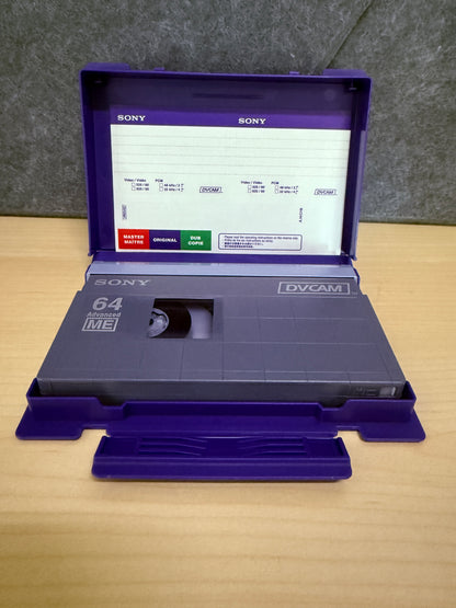 Vintage Sony cassette tape with open purple case on a wooden surface